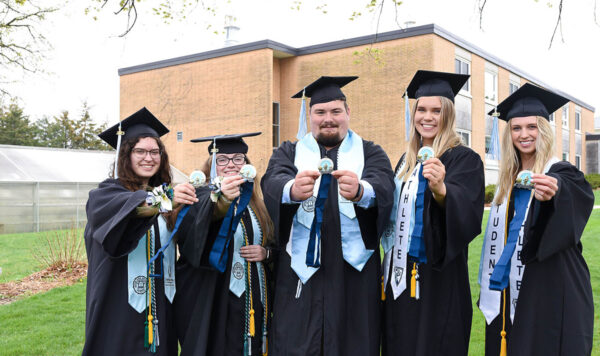 Csomay honors students pose with their medallions at graduation